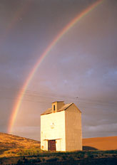 rainbow over eureka farm grain elevator